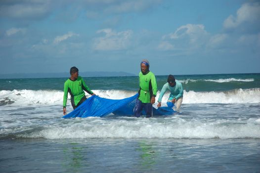 Pangandaran, Indonesia - July 16, 2011: Fisherman at Pangandaran beach, West Java-Indonesia.