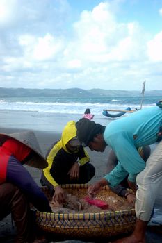 Pangandaran, Indonesia - July 16, 2011: Fisherman at Pangandaran beach, West Java-Indonesia.