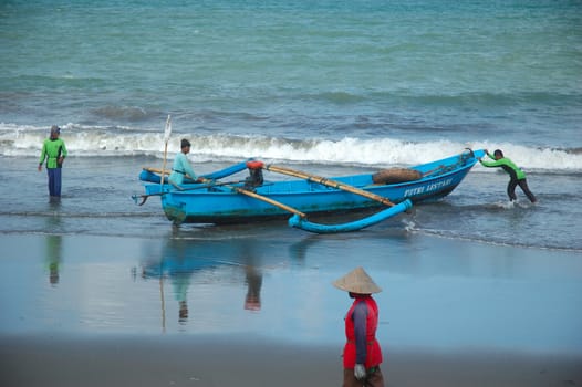 Pangandaran, Indonesia - July 16, 2011: Fisherman at Pangandaran beach, West Java-Indonesia.