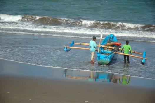 Pangandaran, Indonesia - July 16, 2011: Fisherman at Pangandaran beach, West Java-Indonesia.