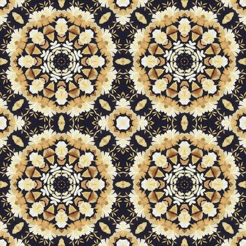 Abstract seamless artistic pattern, floral ornament, handmade applique from painted straw and bark on a black fabric background