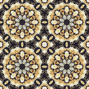 Abstract seamless artistic pattern, floral ornament, handmade applique from painted straw and bark on a black fabric background