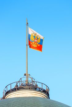 raised the Russian flag on the roof of a government building in the Kremlin