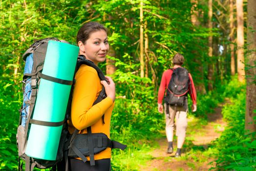 family young couple went to hike in the summer