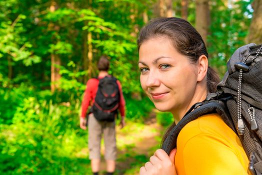 hiking in summer forest with good cheer