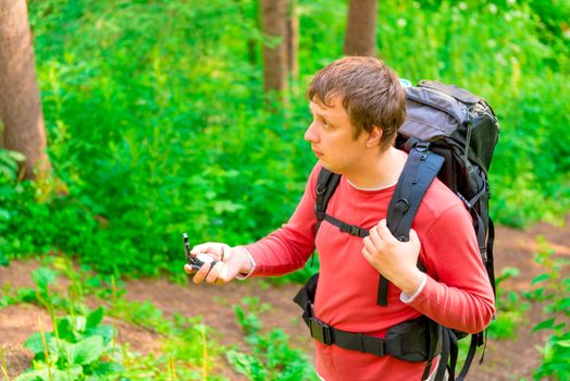 backpackers looking for the way the compass