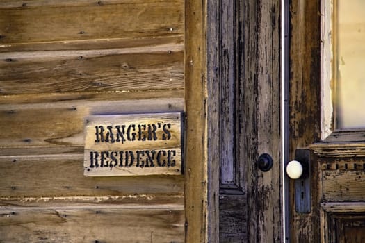 Old rangers residence detail of door and wood wall