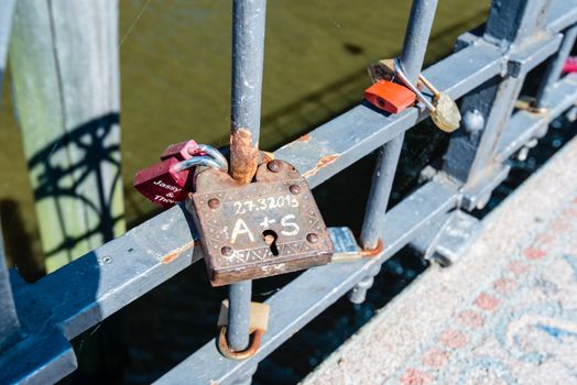 Love lockers on an old bridge in summer