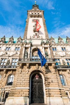 The historical townhall of Hamburg, Germany with local and European flags