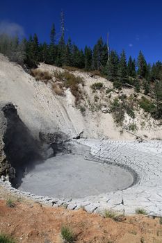 Steam rising from Dragon's Mouth Spring in Yellowstone 