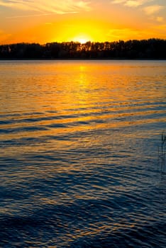 ripples of the lake and the setting sun