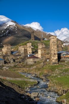Group of houses lying on a bank on the way from Mestia to Ushguli