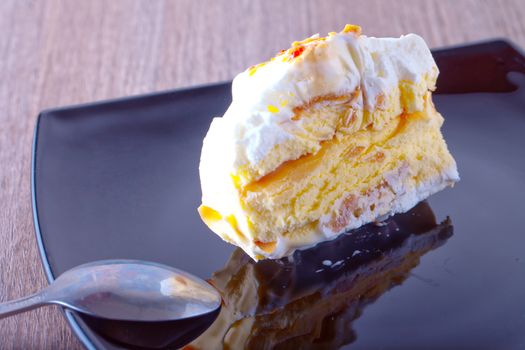 Ice cream cake over a black reflecting plate