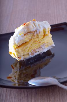 Ice cream cake over a black reflecting plate