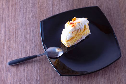 Ice cream cake over a black reflecting plate