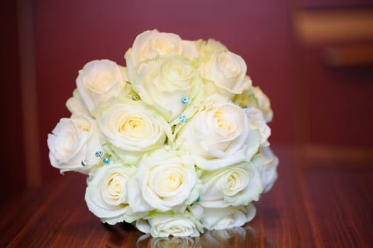 Closeup of brides yellow roses on wedding day