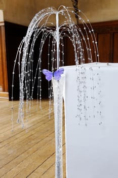 Purple butterfly decoration at wedding ceremony