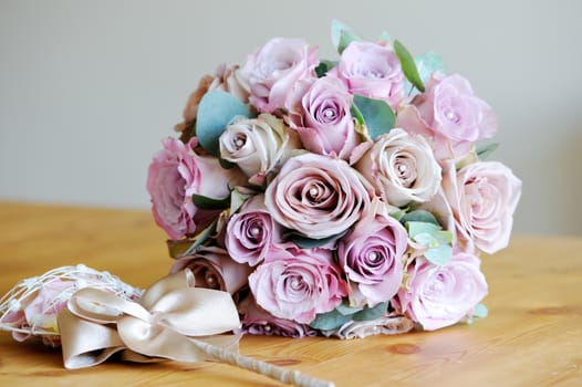 Brides bouquet of pink roses on wedding day