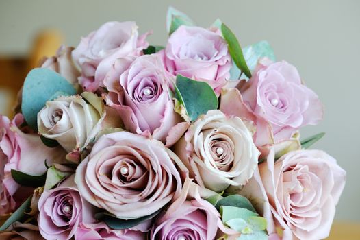 Brides bouquet of pink roses on wedding day