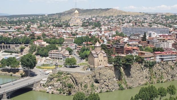 TBILISI, GEORGIA - JUNE 28, 2014: Panorama of Tbilisi with Trinity Church and Metechi Church on June 28, 2014 in Georgia, Europe