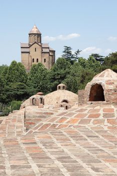 Bath Quarter Abanotubani with Metechi Church in the background, Tbilisi, Georgia, Europe