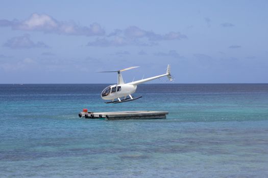 Helipcopter landing on a pontoon in Port Vila, Vanuatu