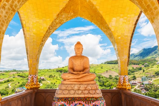 Buddha image and blue sky, Phasornkaew Temple ,that place for meditation that practices, Khao Kho Phetchabun Thailand