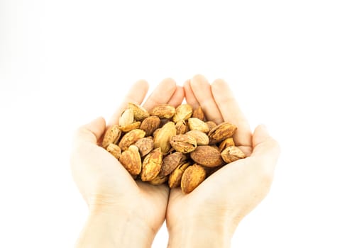 Almonds on hand on a white background.