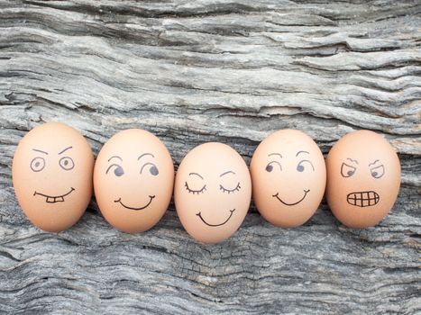 Family of eggs laid on wooden floor