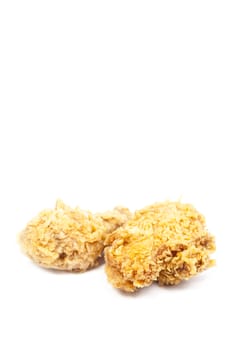 Fried chicken placed on a white background taken in the studio.