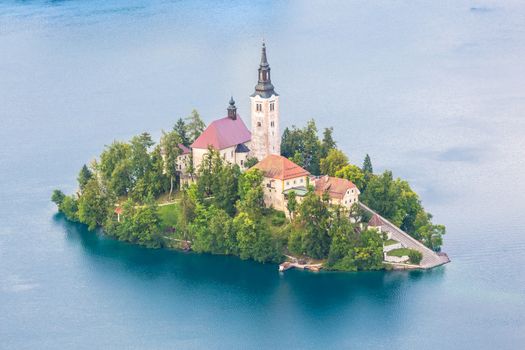 Aerial view of Lake Bled with St. Marys Church of the Assumption on the small island. Bled, Slovenia, Europe. 