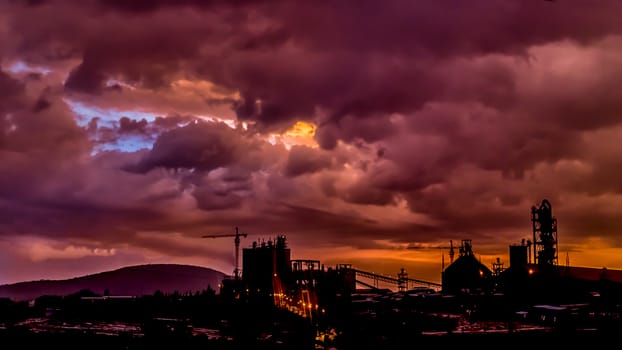 Dark stormy clouds surround the Dire Dawa Cement factory moments after sunset