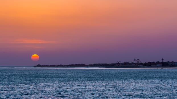 Sun setting over the atlantic ocean near the shores of Dakar, Senegal