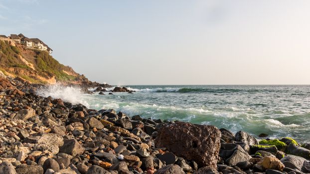 The beautiful waters of the Atlantic ocean with its rocky coastline near the City of Dakar in Senegal