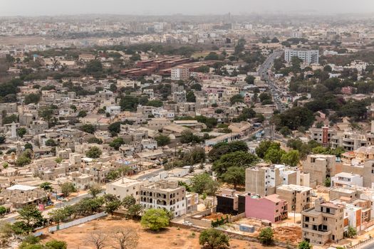 Aerial view of the city of Dakar, Senegal, showing the densely packed buildings and a highway