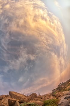 Beautiful spiraling clouds forming in the clouds on a late afternoon