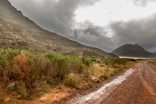 Stormy clouds settling down on the tall mountains of the picturesque landscapes of the Western Cape regions of South Africa