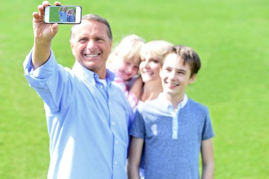 Happy family capturing memorable moment