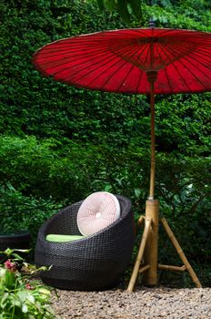 Modern chair of outdoors patio furniture in a backyard 