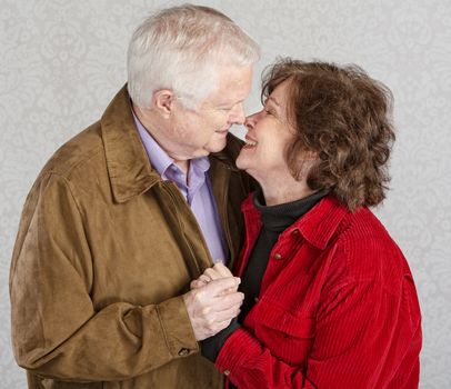 Loving older man and woman kissing each other