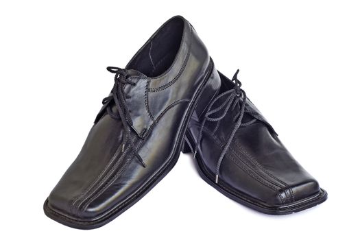 Convenient man's shoes from a genuine leather of black color. Are presented on a white background.