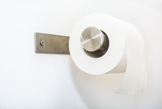 single roll of toilet paper on silver holder