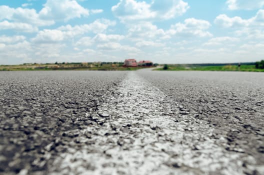 white line on asphalt road close up. soft focus