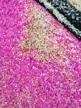 Purple Background with beach sand, close up,