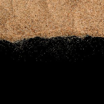 The sand on the black background close-up