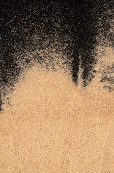 The sand on the black background close-up