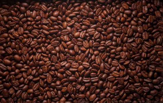 Brown roasted coffee beans texture close up