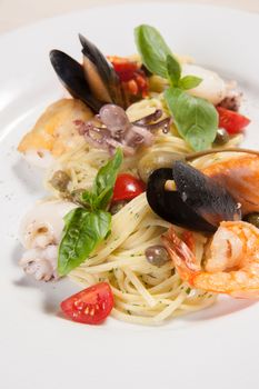 White dish with pasta and sea food