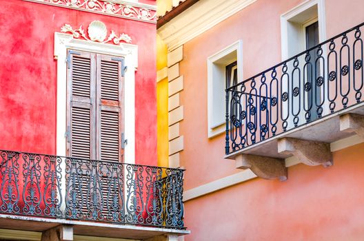 Detail view of colorful walls and balconies with windows and doors