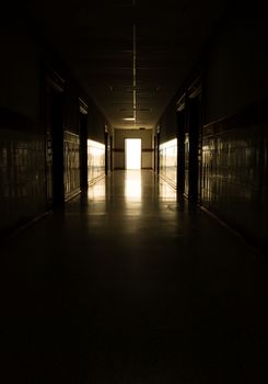 Dark corridor and light at door